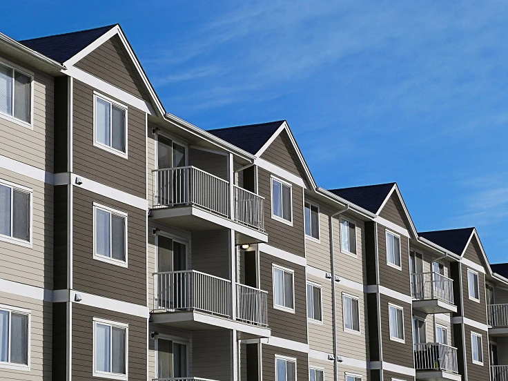 Condominiums with gray RISE composite siding