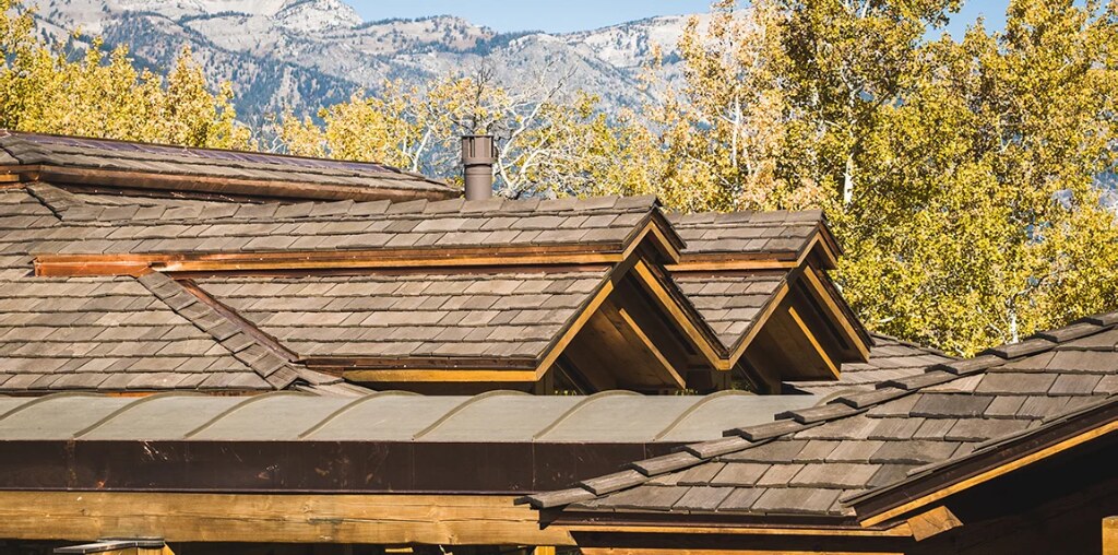 Home with a synthetic cedar shake roof in a mountain setting